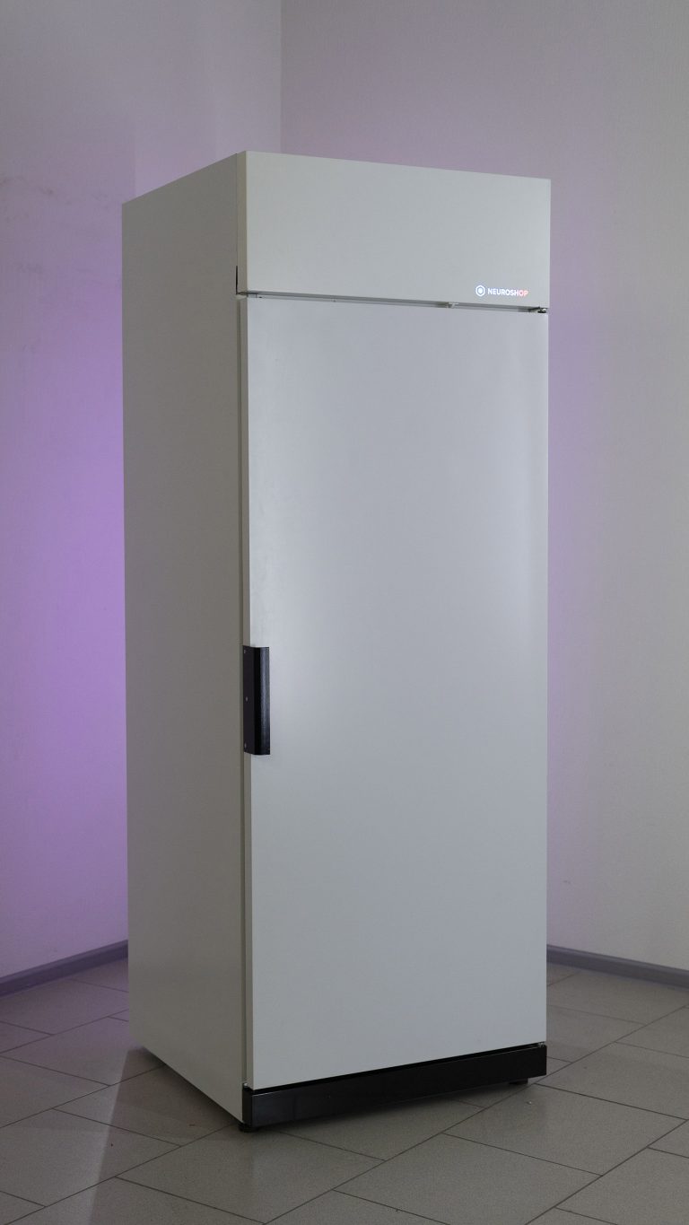 White cabinet with a closed solid door and a vertical handle