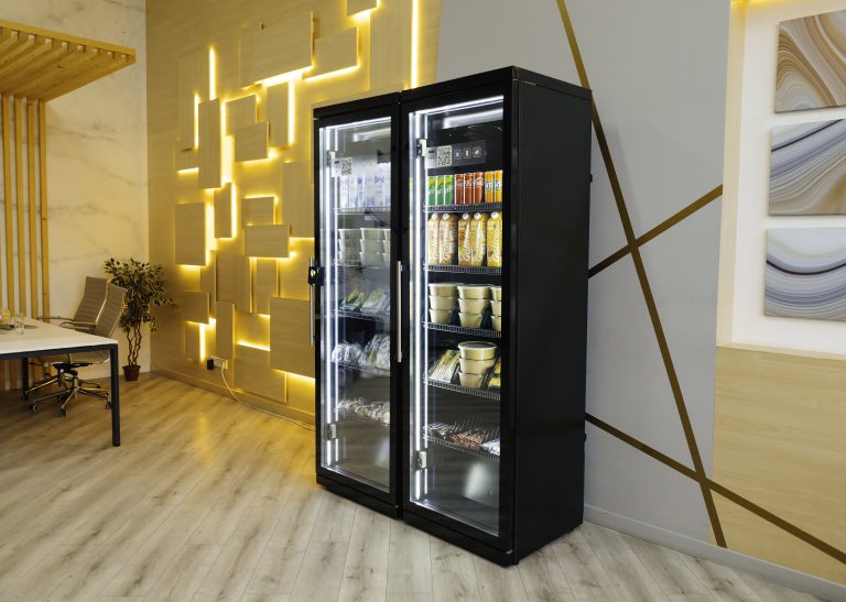 Two-door black cabinet with glass fronts in a room with a desk and an office chair