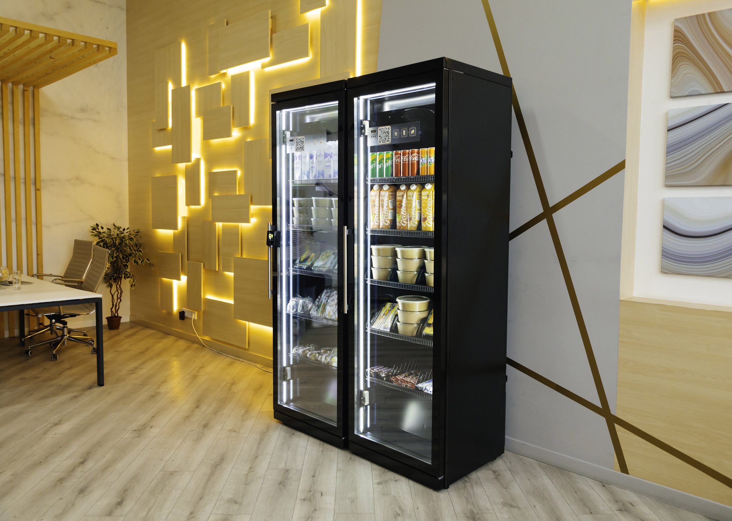 Two-door black cabinet with glass fronts in a room with a desk and an office chair
